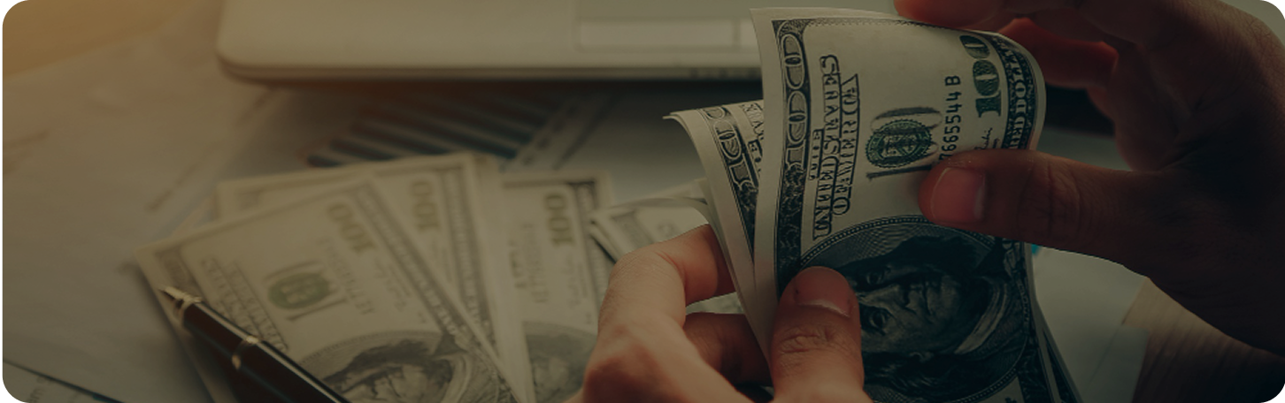 Hands holding cash money