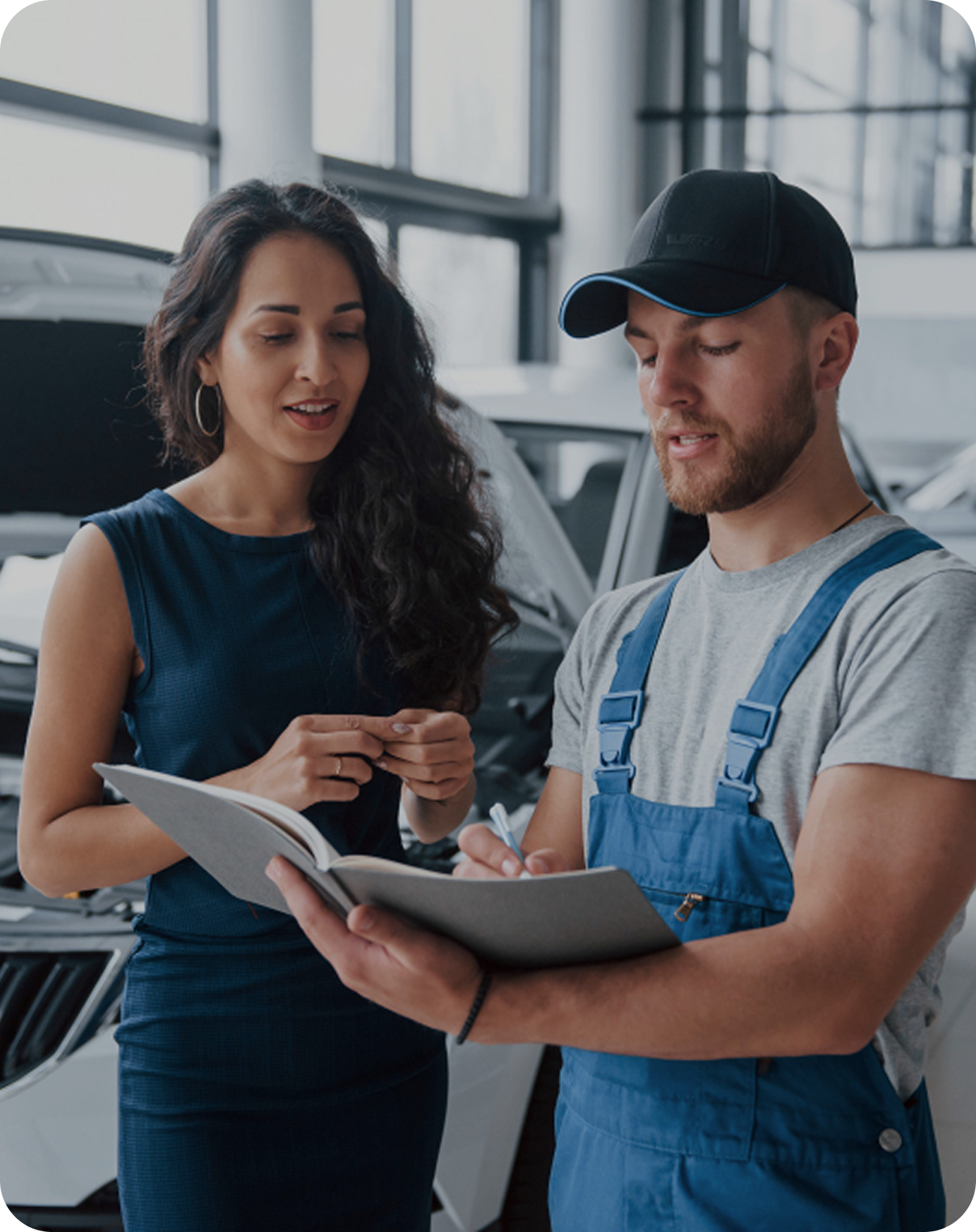 Professional man standing next to damaged car